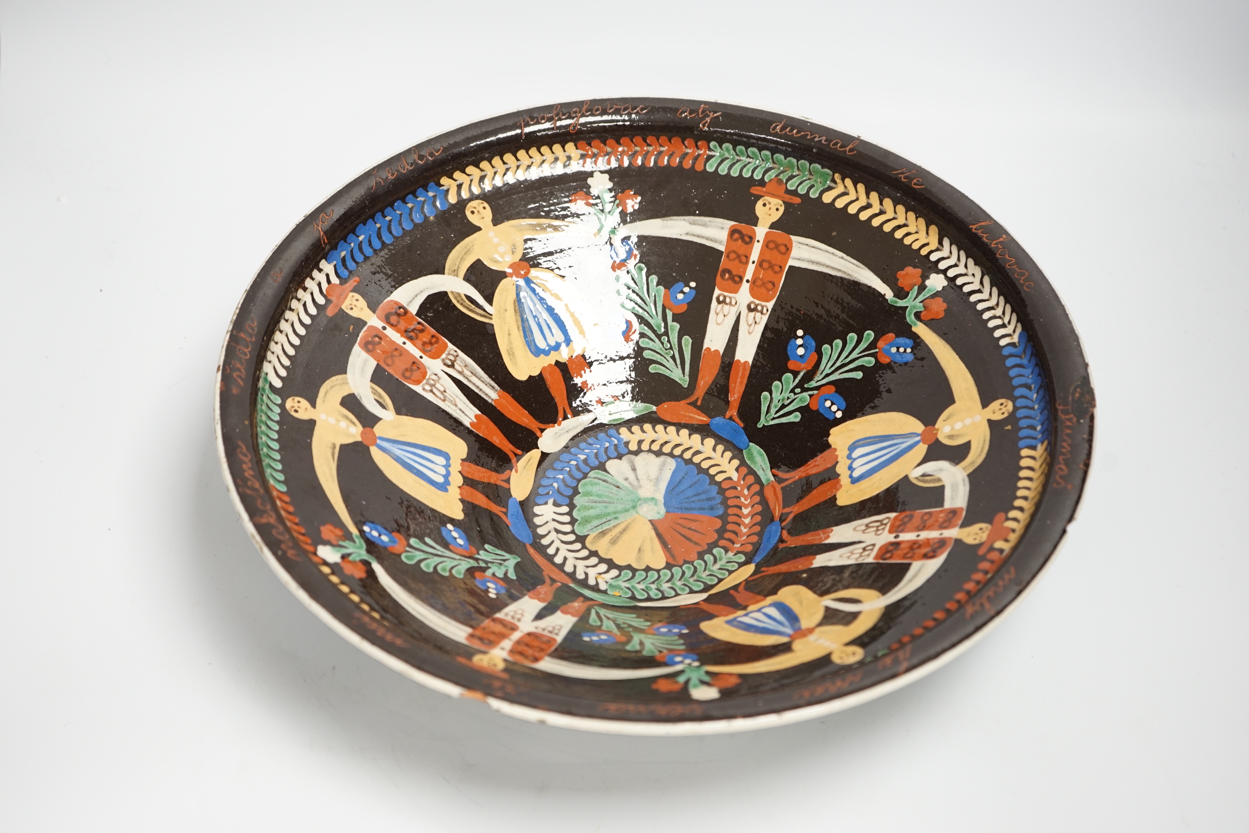 A large Continental slipware dish, probably Hungarian, 35cm